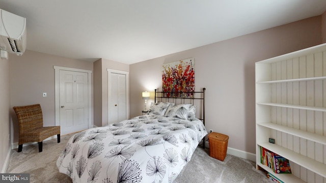 carpeted bedroom with a closet and a wall mounted air conditioner