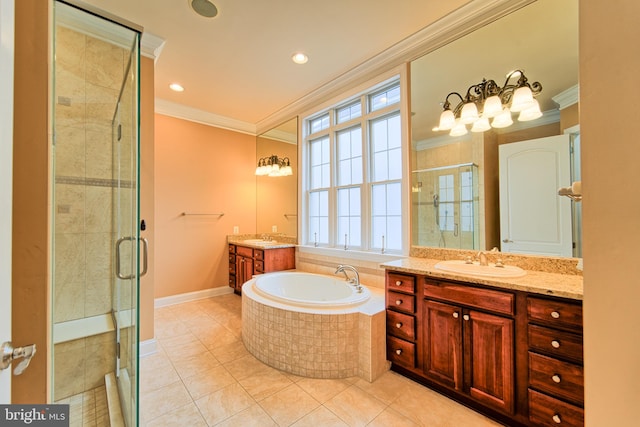 full bath featuring a garden tub, ornamental molding, a stall shower, a sink, and tile patterned flooring