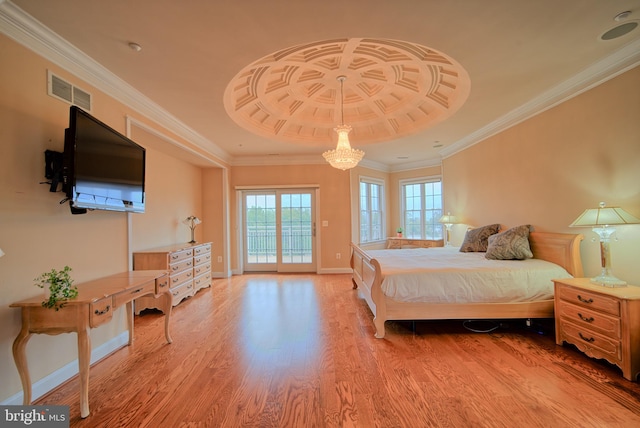 bedroom with wood finished floors, visible vents, baseboards, access to exterior, and crown molding