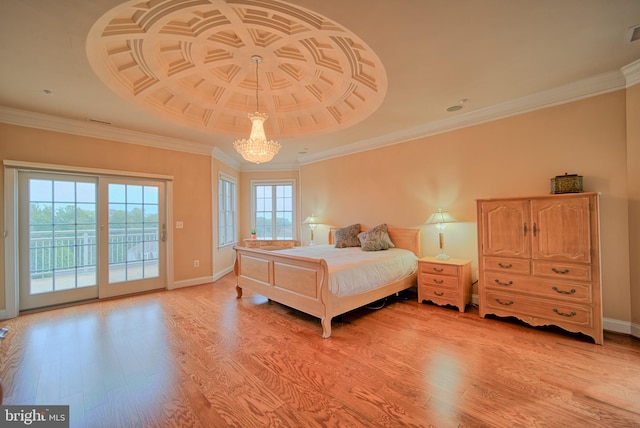 bedroom featuring light wood finished floors, baseboards, access to exterior, crown molding, and a chandelier