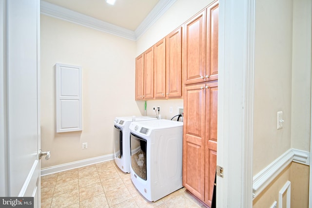 clothes washing area with crown molding, light tile patterned floors, cabinet space, washing machine and dryer, and baseboards