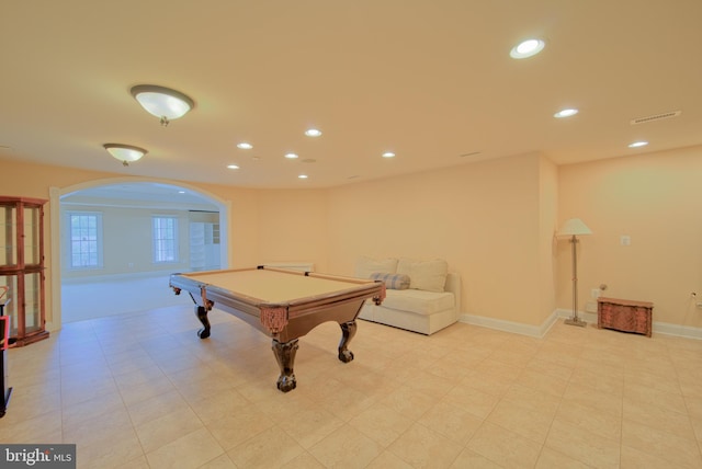 recreation room with arched walkways, visible vents, baseboards, and recessed lighting