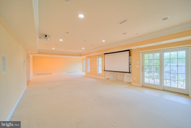 unfurnished living room with ornamental molding, visible vents, and light colored carpet