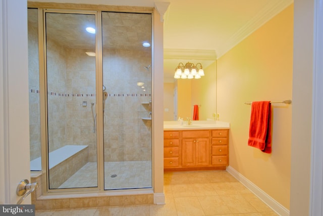 bathroom featuring vanity, baseboards, tile patterned floors, a stall shower, and crown molding