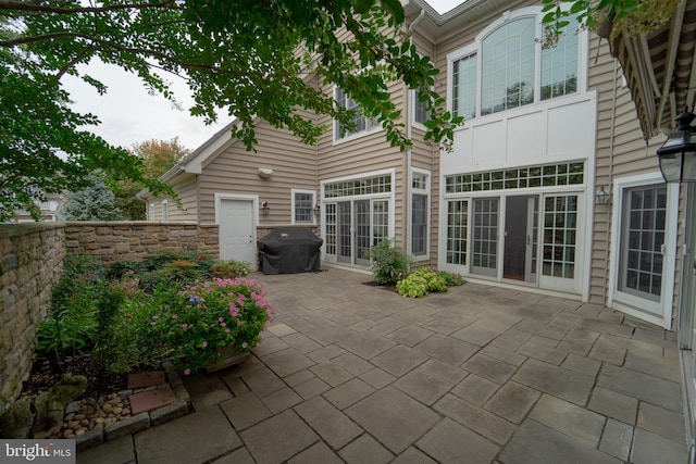 exterior space with french doors and a patio area