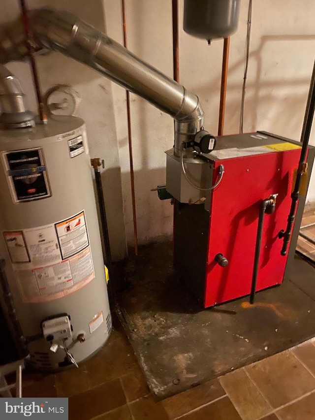 utility room featuring gas water heater