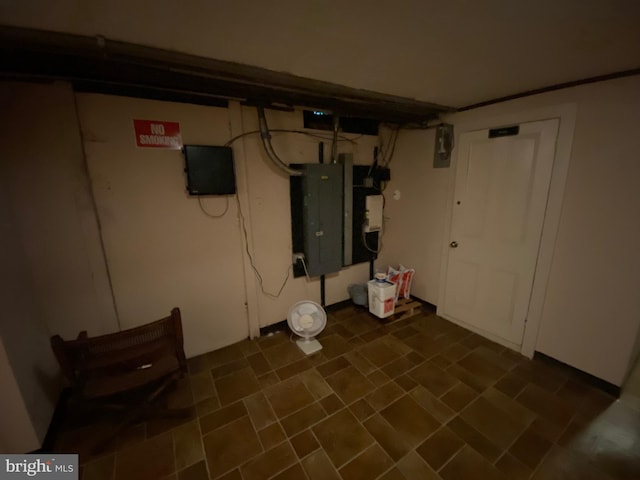 basement featuring dark tile patterned flooring