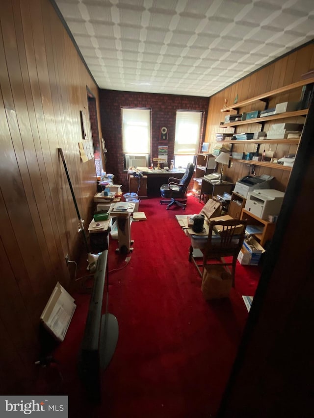 misc room featuring cooling unit, carpet flooring, and wooden walls