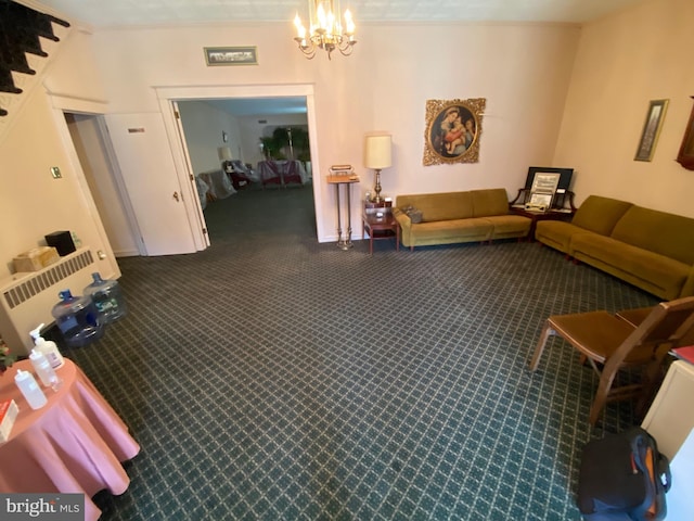 carpeted living room with an inviting chandelier