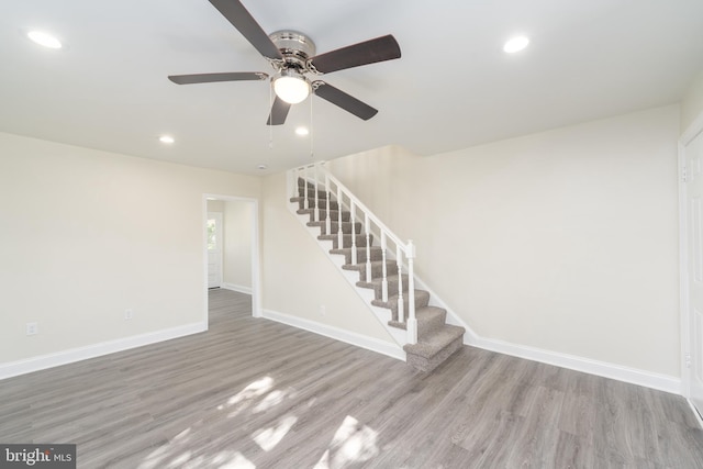 interior space featuring hardwood / wood-style floors and ceiling fan