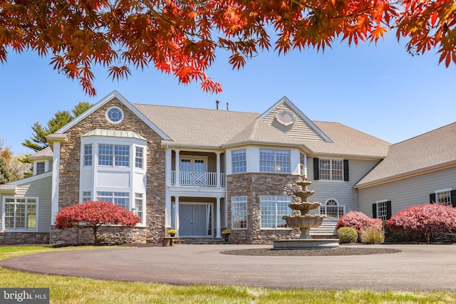 view of front of property with a balcony