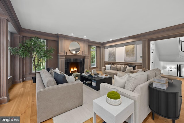 living room featuring light hardwood / wood-style flooring and lofted ceiling