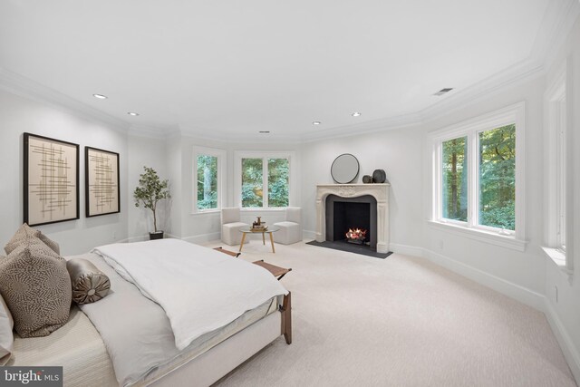 bedroom featuring crown molding, multiple windows, and light carpet