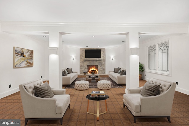 living room featuring crown molding and a stone fireplace