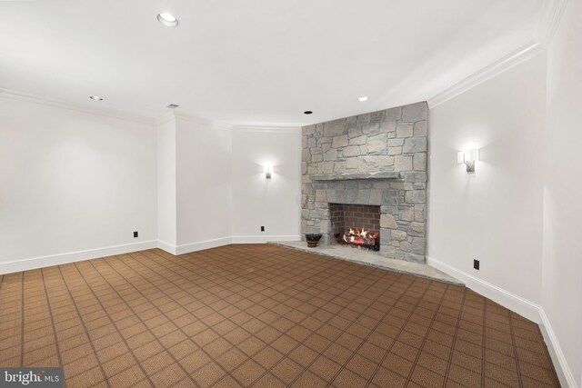 unfurnished living room with a fireplace and crown molding