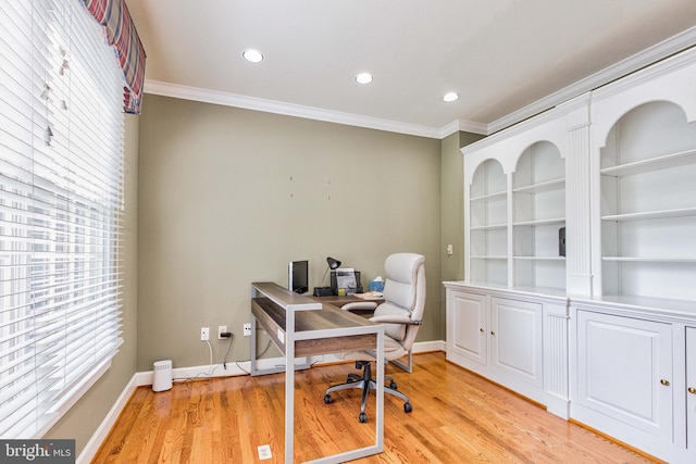 office with crown molding and light hardwood / wood-style flooring