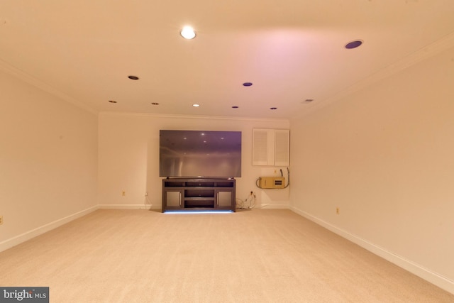 unfurnished living room with ornamental molding and carpet flooring