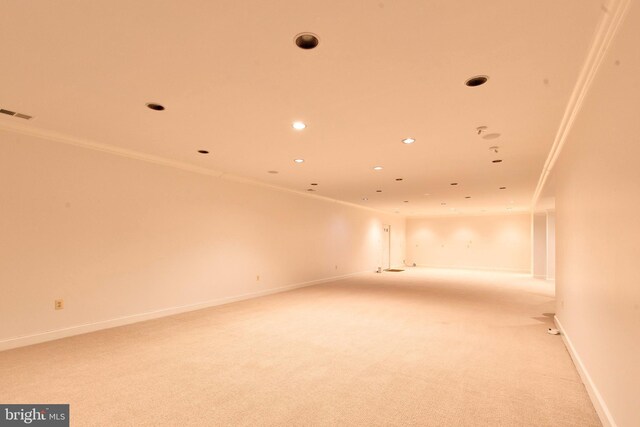 carpeted dining room featuring crown molding