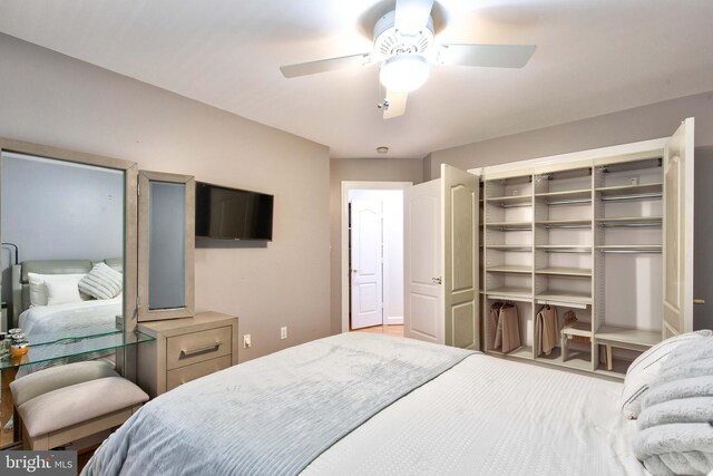 bedroom with wood-type flooring and ceiling fan