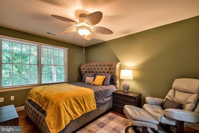 bedroom with hardwood / wood-style flooring and ceiling fan