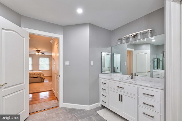 bathroom with vanity, tile patterned flooring, and ceiling fan