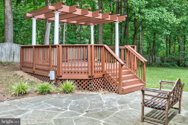 exterior space featuring a pergola and a deck