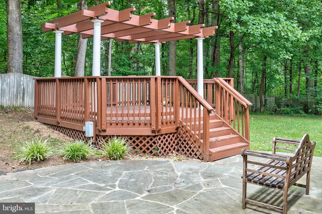 deck featuring a pergola and a patio area