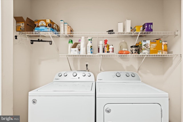 washroom featuring washing machine and dryer