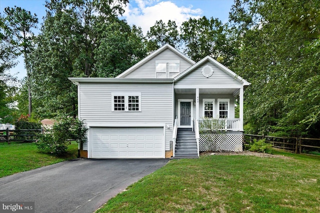 view of front facade with a front yard, a porch, and a garage