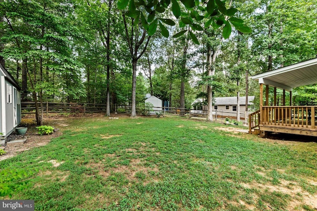 view of yard featuring a wooden deck