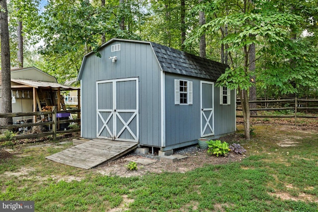 view of outdoor structure with a lawn