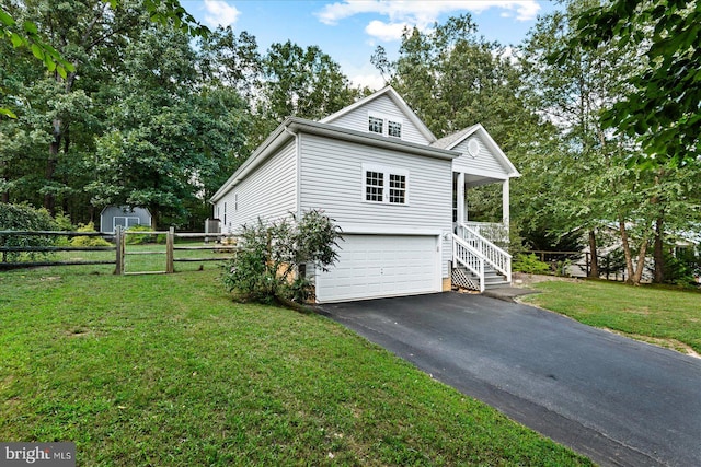 view of home's exterior featuring a garage and a lawn