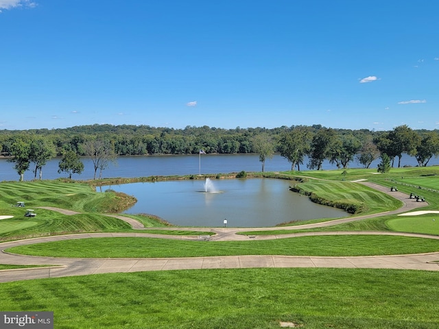 surrounding community featuring a water view and a lawn