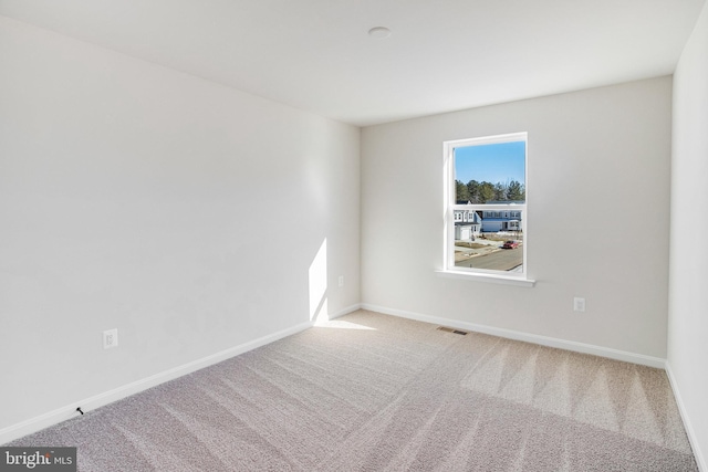 spare room with carpet flooring