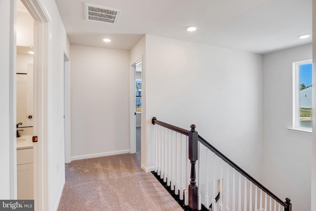 corridor with carpet flooring