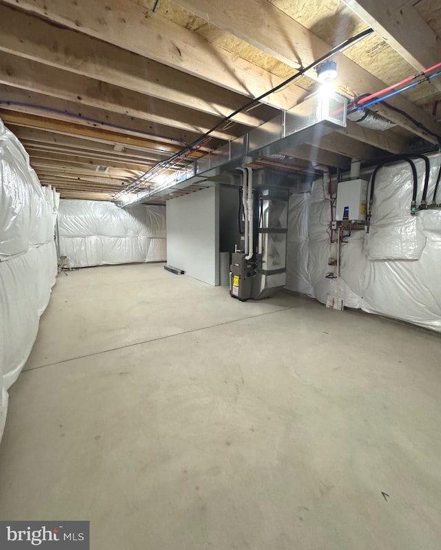 basement featuring heating unit