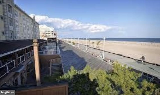 property view of water featuring a beach view