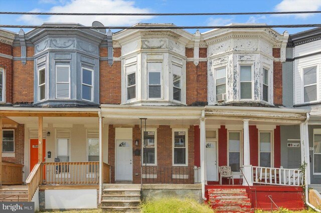 townhome / multi-family property with covered porch