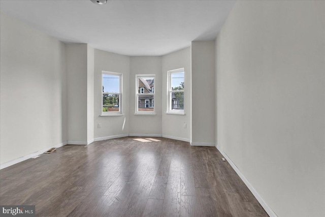 empty room with wood-type flooring