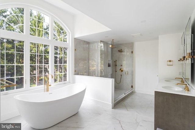 bathroom with tile patterned flooring, independent shower and bath, and double sink vanity