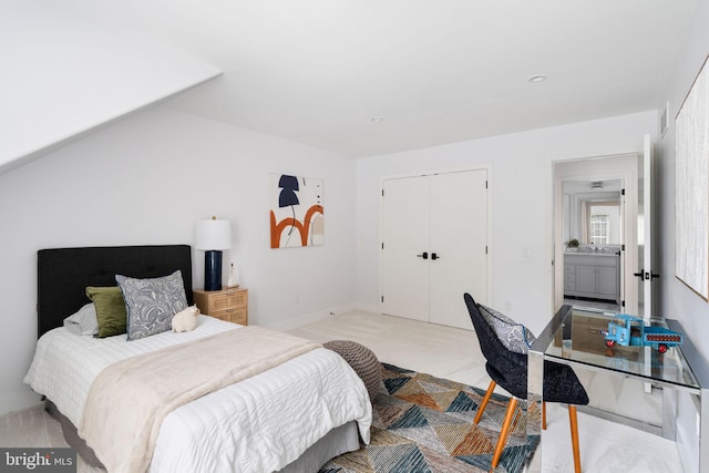 bedroom featuring a closet and ensuite bathroom