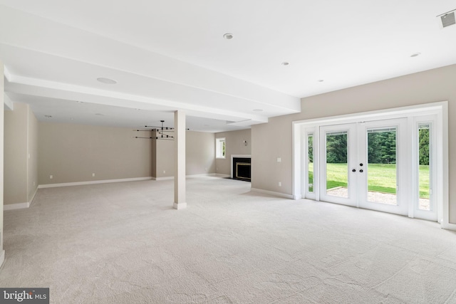 basement with light colored carpet and french doors