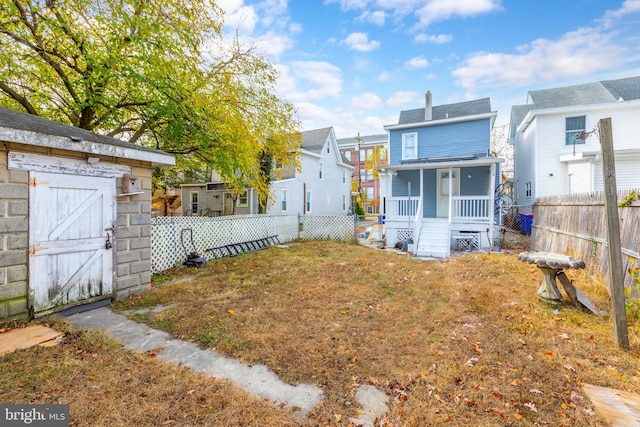 view of yard featuring covered porch