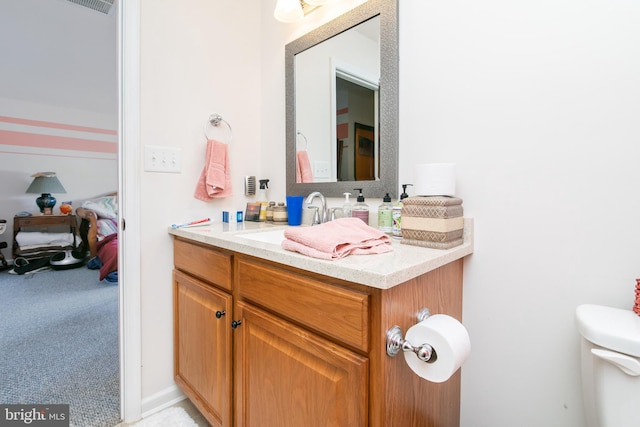 bathroom with vanity and toilet