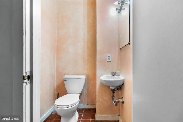 bathroom featuring tile patterned floors, sink, and toilet