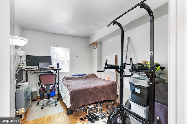 bedroom with hardwood / wood-style floors