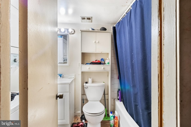 full bathroom featuring shower / tub combo, vanity, and toilet