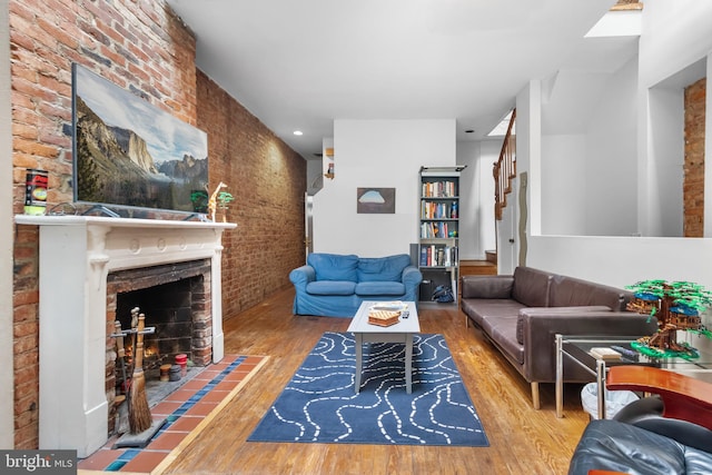 living room with a fireplace and hardwood / wood-style floors