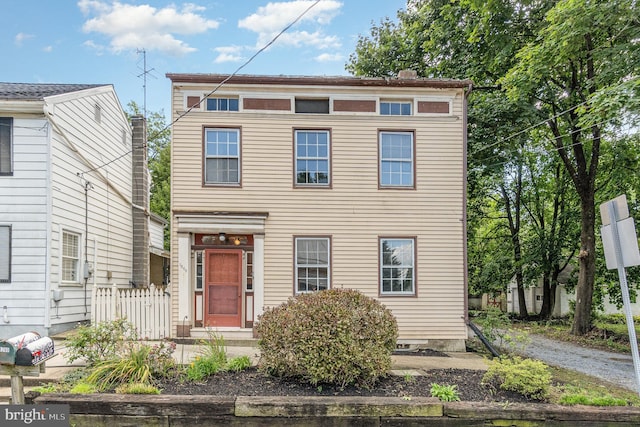 view of front of house with fence