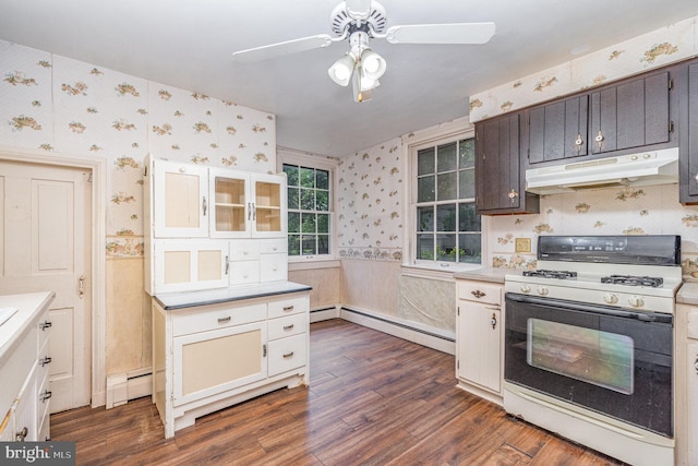 kitchen with dark hardwood / wood-style floors, white range with gas cooktop, dark brown cabinets, and a baseboard heating unit